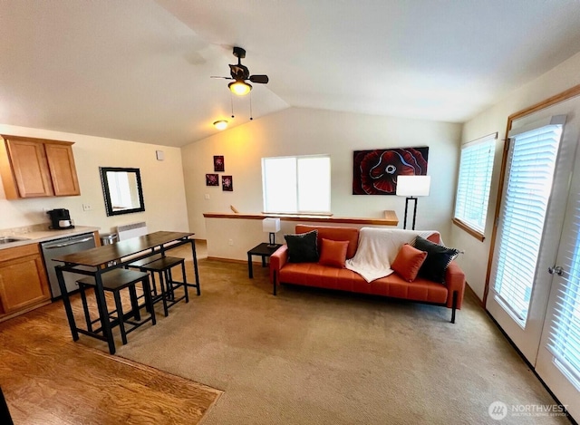 408 Eddy Ct, Port Townsend, WA 98368 - living room featuring vaulted ceiling, ceiling fan, and light colored carpet