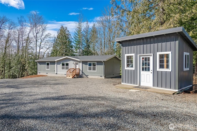 3563 Sweet Rd, Blaine, WA 98230 - view of front of house featuring board and batten siding, crawl space, and a shed
