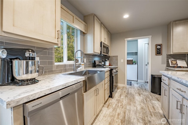 3563 Sweet Rd, Blaine, WA 98230 - kitchen with stainless steel appliances, recessed lighting, backsplash, and light wood-style floors