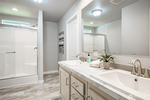 3563 Sweet Rd, Blaine, WA 98230 - full bath with an enclosed shower, wood finished floors, double vanity, and recessed lighting