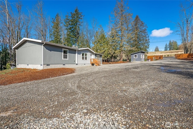 3563 Sweet Rd, Blaine, WA 98230 - view of front facade with crawl space and a storage unit