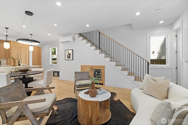 231 19th Ave, Kirkland, WA 98033 - living room featuring an AC wall unit, light wood-type flooring, stairs, and recessed lighting