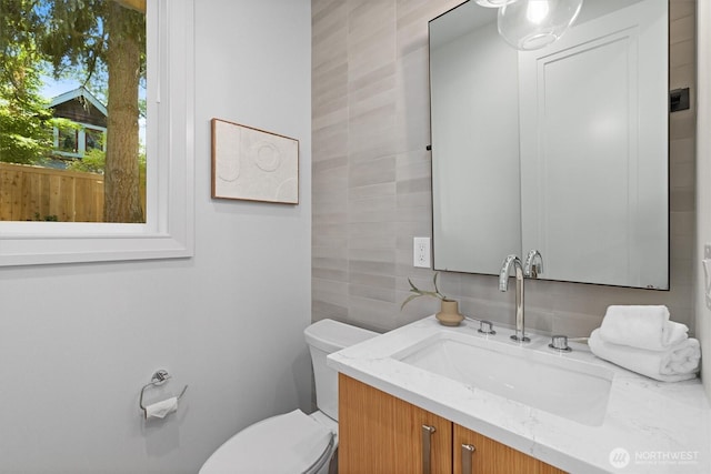 231 19th Ave, Kirkland, WA 98033 - bathroom featuring tile walls, vanity, and backsplash
