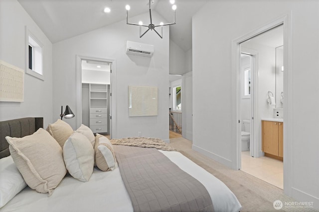 231 19th Ave, Kirkland, WA 98033 - bedroom with an AC wall unit, a spacious closet, light colored carpet, a chandelier, and high vaulted ceiling