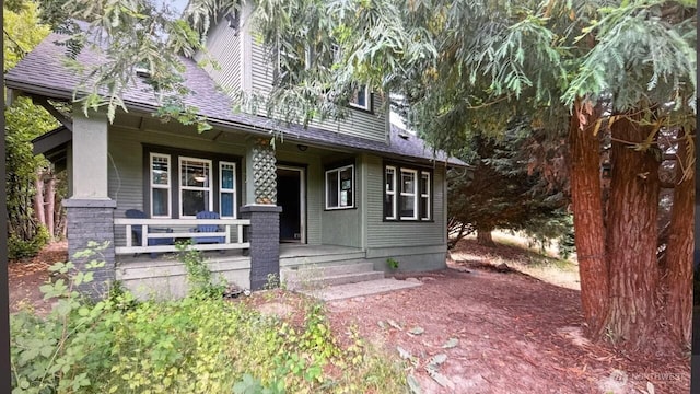 4061 E Howe St, Tacoma, WA 98404 - view of front of house with covered porch and roof with shingles
