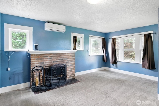4061 E Howe St, Tacoma, WA 98404 - unfurnished living room with a wall mounted AC, a textured ceiling, a fireplace, and carpet