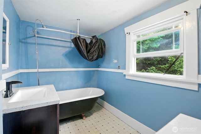4061 E Howe St, Tacoma, WA 98404 - full bath featuring a freestanding bath, vanity, and tile patterned floors