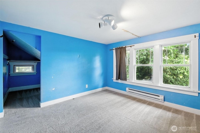 4061 E Howe St, Tacoma, WA 98404 - carpeted spare room featuring a baseboard heating unit and plenty of natural light
