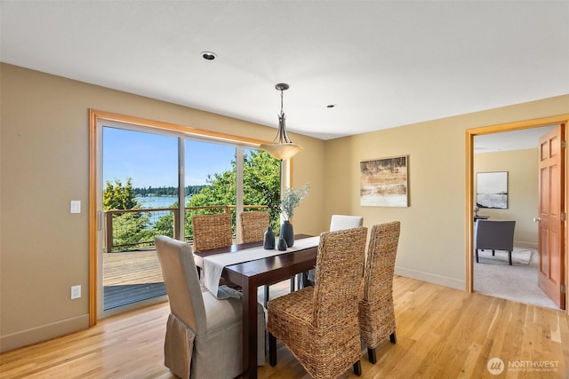 6701 Macintosh Ct SE, Olympia, WA 98513 - dining area featuring light wood-style floors and a water view