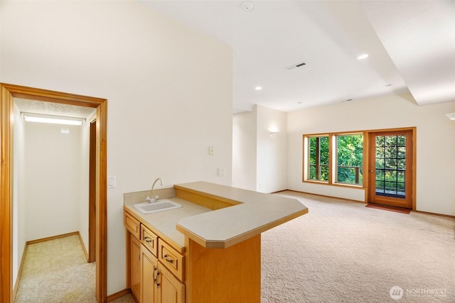 6701 Macintosh Ct SE, Olympia, WA 98513 - kitchen with light carpet, open floor plan, a peninsula, light countertops, and recessed lighting