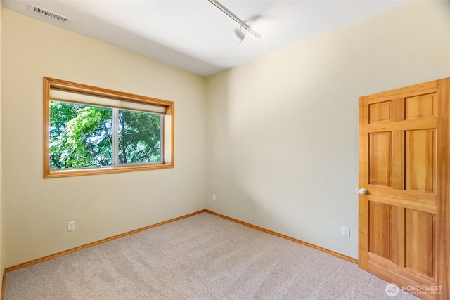 6701 Macintosh Ct SE, Olympia, WA 98513 - empty room with rail lighting and carpet floors