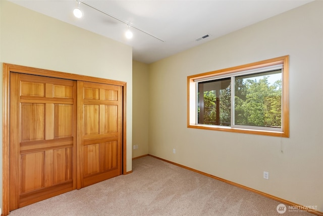 6701 Macintosh Ct SE, Olympia, WA 98513 - unfurnished bedroom with rail lighting and carpet floors