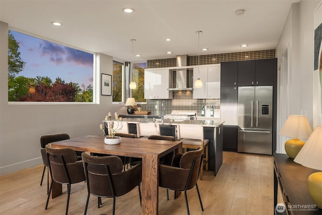 1629 42nd Ave E Unit B, Seattle, WA 98112 - dining area with light wood-style flooring and recessed lighting