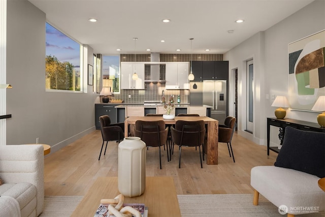 1629 42nd Ave E Unit B, Seattle, WA 98112 - dining area featuring light wood-style floors and recessed lighting