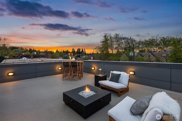 1629 42nd Ave E Unit B, Seattle, WA 98112 - patio terrace at dusk with a fire pit and a patio
