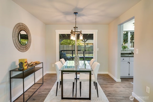 8106 186th Street Ct E, Puyallup, WA 98375 - dining room featuring a chandelier, healthy amount of natural light, and wood finished floors