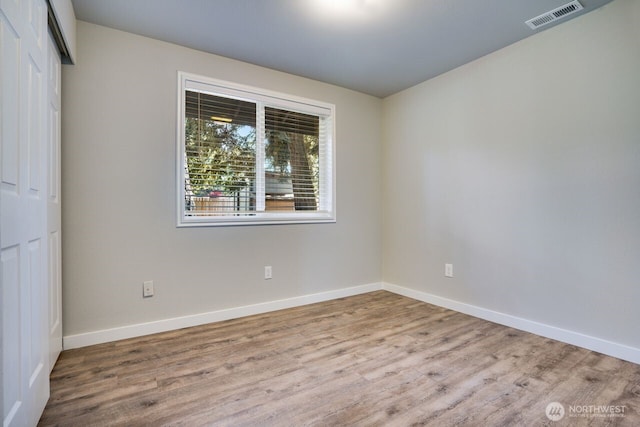 8106 186th Street Ct E, Puyallup, WA 98375 - empty room with wood finished floors and baseboards