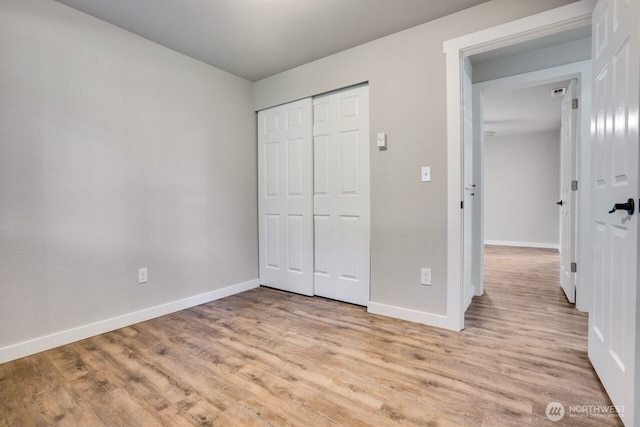 8106 186th Street Ct E, Puyallup, WA 98375 - unfurnished bedroom with light wood-type flooring and a closet