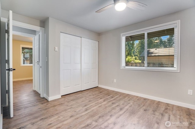 8106 186th Street Ct E, Puyallup, WA 98375 - unfurnished bedroom with wood finished floors, a closet, and a ceiling fan