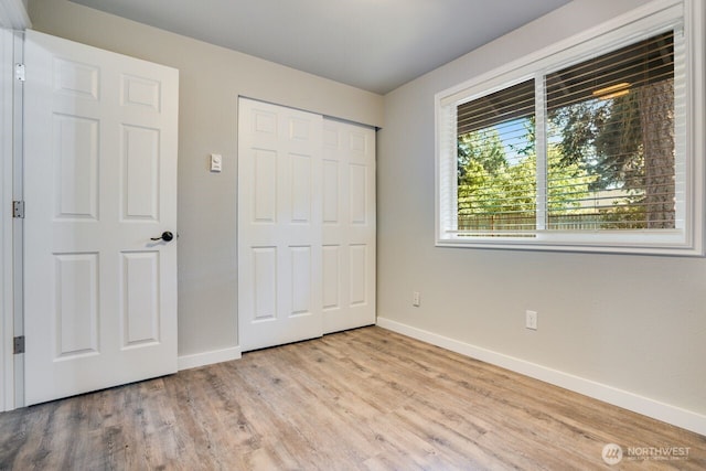 8106 186th Street Ct E, Puyallup, WA 98375 - unfurnished bedroom with wood finished floors and a closet