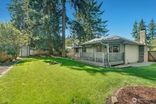 8106 186th Street Ct E, Puyallup, WA 98375 - fenced backyard with a fire pit and a shed