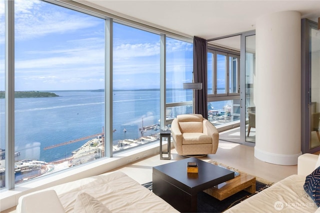1521 2nd Ave Unit 2303, Seattle, WA 98101 - living room with a water view and a wall of windows