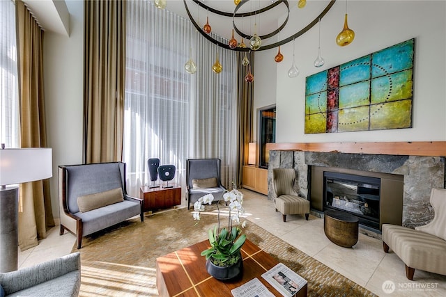 1521 2nd Ave Unit 2303, Seattle, WA 98101 - living room featuring a towering ceiling, healthy amount of natural light, and a high end fireplace