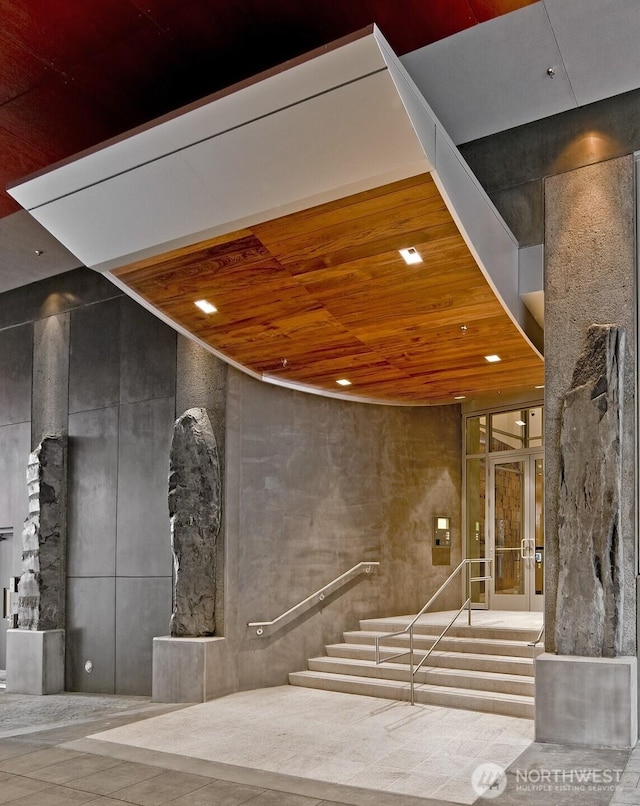 1521 2nd Ave Unit 2303, Seattle, WA 98101 - building lobby featuring wood ceiling, stairs, and recessed lighting