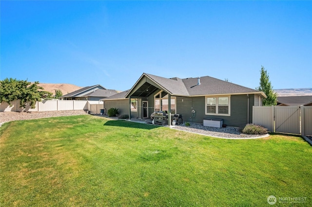 3516 Dianna Way, Wenatchee, WA 98801 - back of house featuring a fenced backyard, a patio area, and a gate