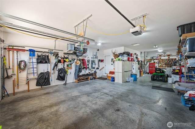 3516 Dianna Way, Wenatchee, WA 98801 - garage featuring a garage door opener and a workshop area