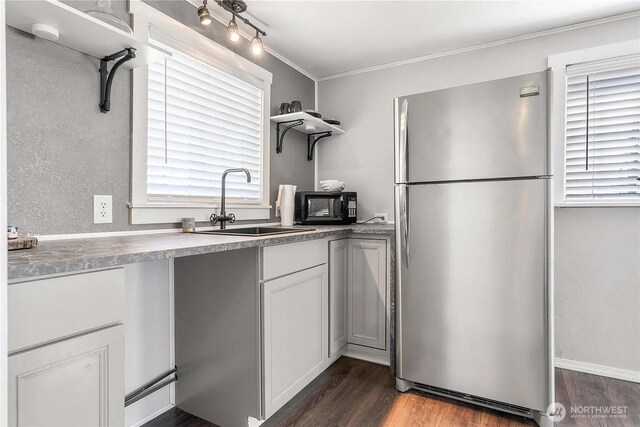 4476 Birch Bay Lynden Rd, Birch Bay, WA 98230 - kitchen featuring freestanding refrigerator, open shelves, dark wood finished floors, black microwave, and crown molding