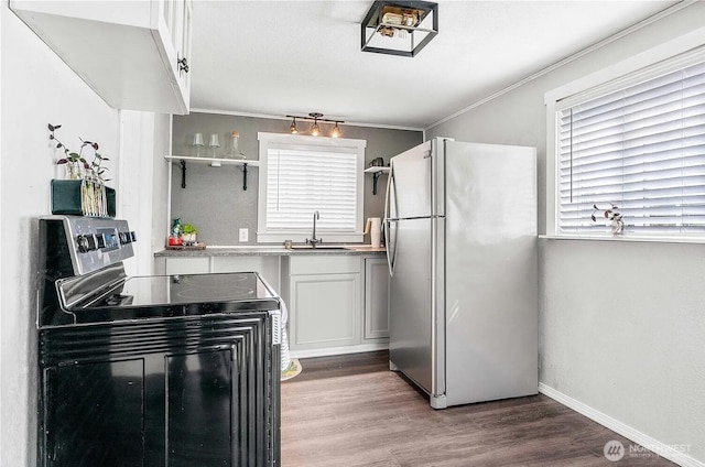 4476 Birch Bay Lynden Rd, Birch Bay, WA 98230 - kitchen featuring electric range, freestanding refrigerator, light wood-type flooring, open shelves, and white cabinets