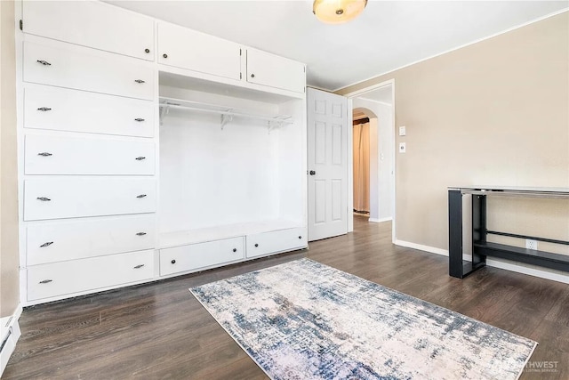 4476 Birch Bay Lynden Rd, Birch Bay, WA 98230 - unfurnished bedroom with arched walkways, dark wood-style floors, and a baseboard heating unit