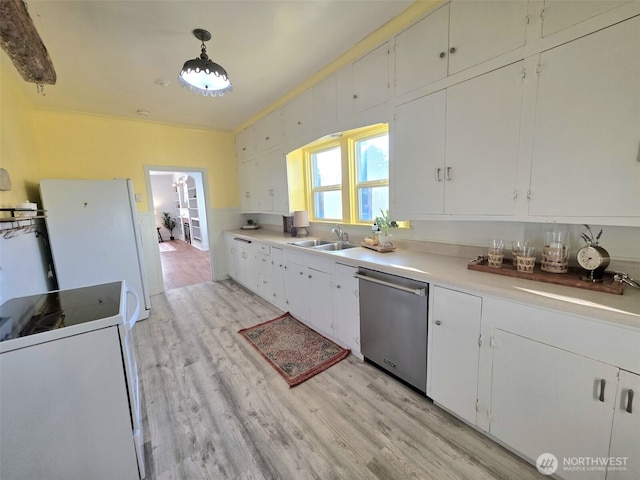 321 12th St, Raymond, WA 98577 - kitchen featuring white appliances, light wood-type flooring, and white cabinetry