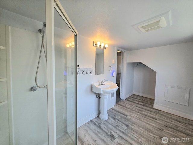 321 12th St, Raymond, WA 98577 - full bath featuring a shower stall and wood finished floors