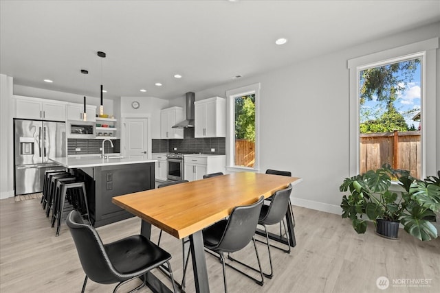 1427 114th Ave E, Edgewood, WA 98372 - dining room featuring light wood-type flooring and recessed lighting