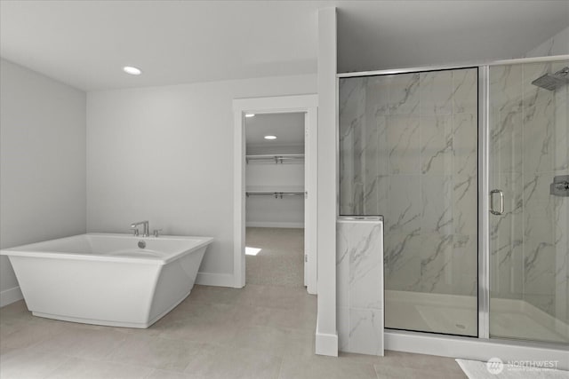 1427 114th Ave E, Edgewood, WA 98372 - full bathroom featuring a freestanding bath, a marble finish shower, recessed lighting, and a spacious closet