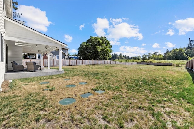 1427 114th Ave E, Edgewood, WA 98372 - fenced backyard featuring a patio and an outdoor living space