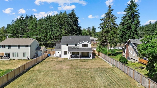 1427 114th Ave E, Edgewood, WA 98372 - back of house with a fenced backyard and a patio area