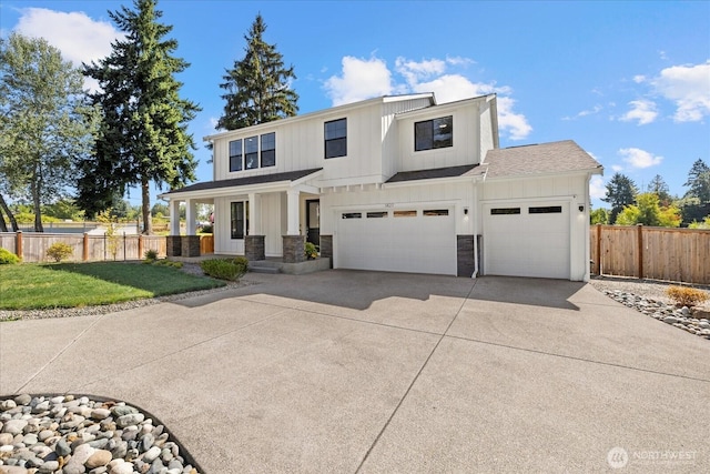 1427 114th Ave E, Edgewood, WA 98372 - modern farmhouse style home with driveway, a garage, stone siding, board and batten siding, and roof with shingles