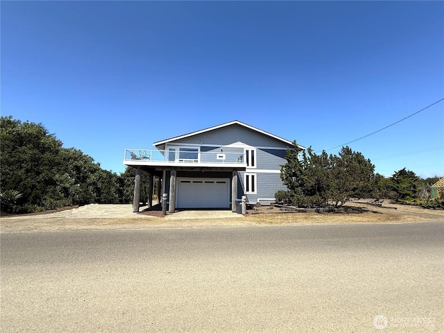 101 Sand Dune Ave NW, Ocean Shores, WA 98569 - view of front of property featuring an attached garage, driveway, and a deck