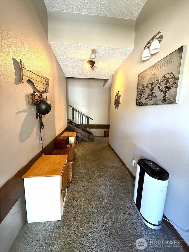 101 Sand Dune Ave NW, Ocean Shores, WA 98569 - hallway featuring a textured ceiling and baseboards