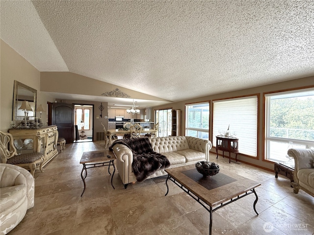 101 Sand Dune Ave NW, Ocean Shores, WA 98569 - living area featuring a chandelier, a textured ceiling, vaulted ceiling, healthy amount of natural light, and stone finish floors