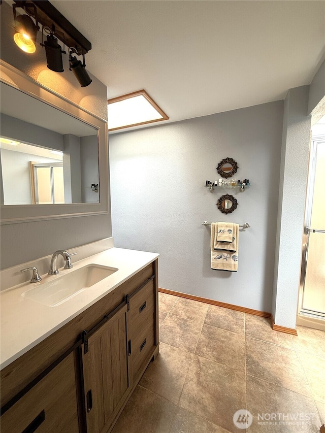 101 Sand Dune Ave NW, Ocean Shores, WA 98569 - bathroom featuring vanity and baseboards