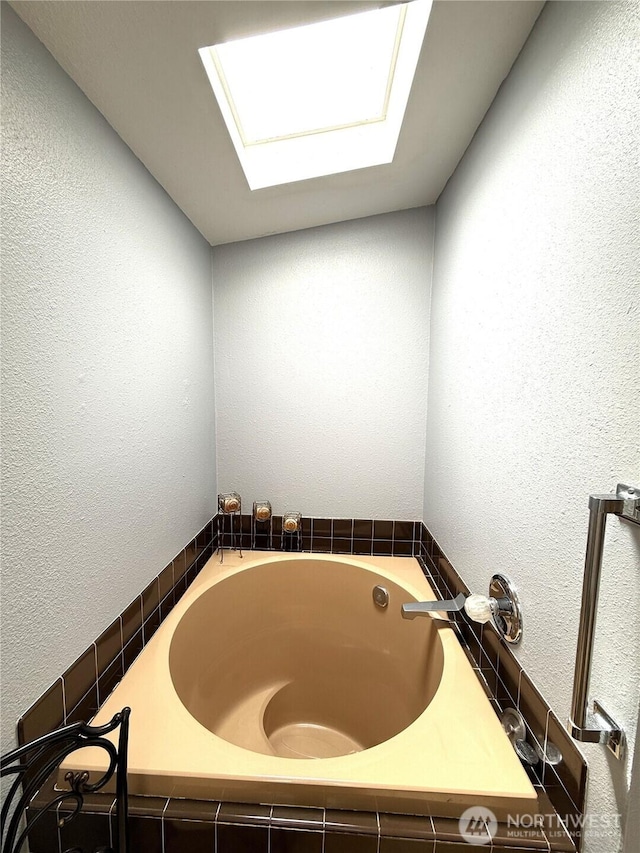101 Sand Dune Ave NW, Ocean Shores, WA 98569 - full bathroom featuring a bath and a skylight