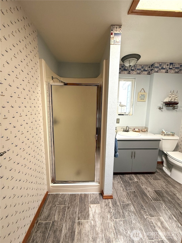 101 Sand Dune Ave NW, Ocean Shores, WA 98569 - bathroom with a shower stall, vanity, and wood tiled floors
