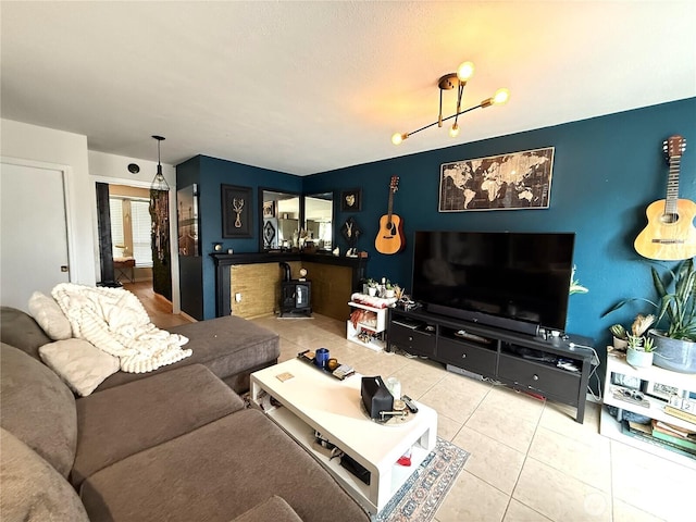 101 Sand Dune Ave NW, Ocean Shores, WA 98569 - living room featuring tile patterned floors and a wood stove