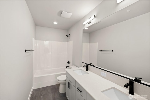 13931 178th St E Unit 39, Puyallup, WA 98374 - bathroom with double vanity, bathtub / shower combination, wood finished floors, and recessed lighting