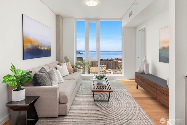 450 S Main St Unit 1608, Seattle, WA 98104 - living area with a water view and light wood-style floors