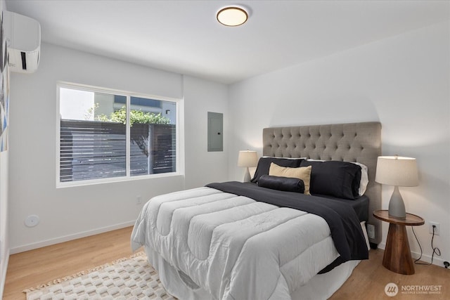 918 28th Ave S Unit B, Seattle, WA 98144 - bedroom with wood finished floors, a wall mounted air conditioner, and electric panel